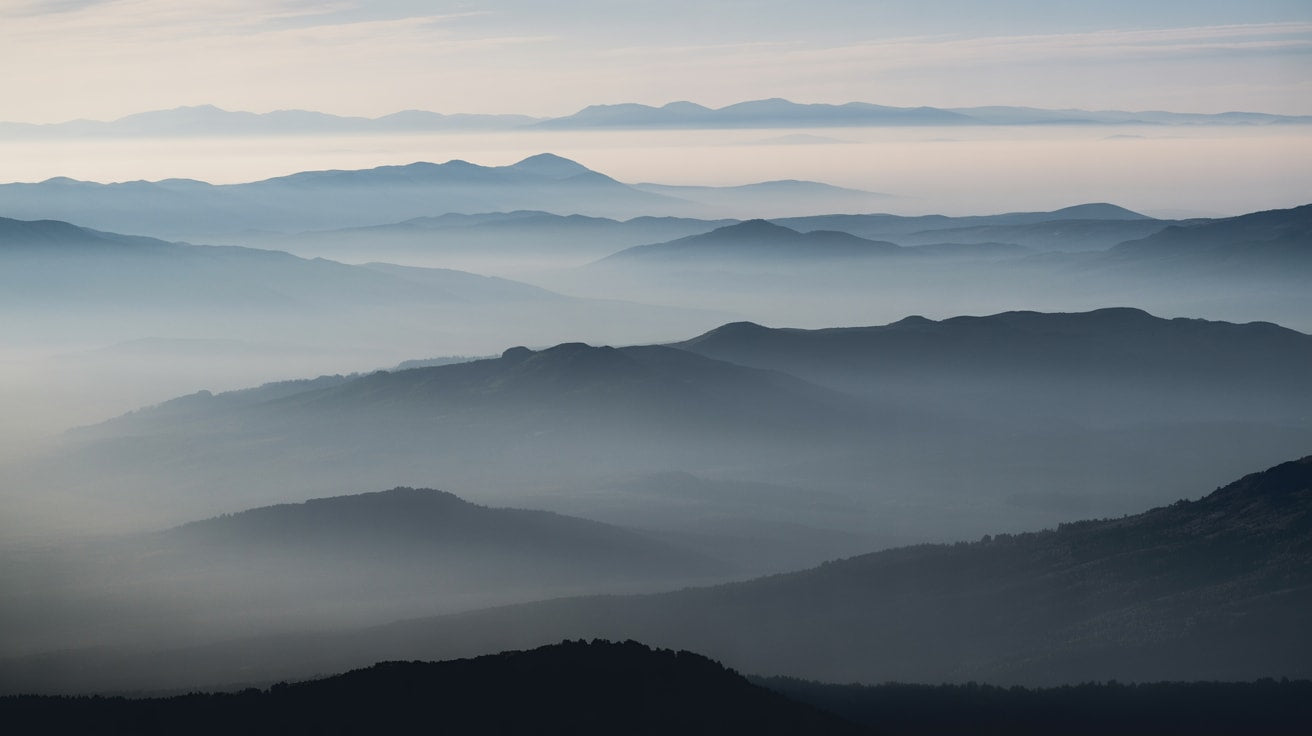 Ethereal serene Misty Blue misty mountains - Wall Mural & Peel and Stick Wallpaper for Minimalist Interiors and Premium Home Styling.